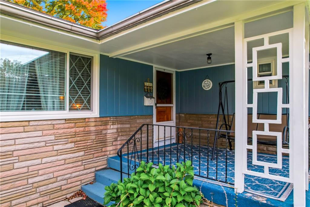 409 Patt Drive Farrell, PA 16121 - Photo 5 of 50 a view of front door of house with potted plant