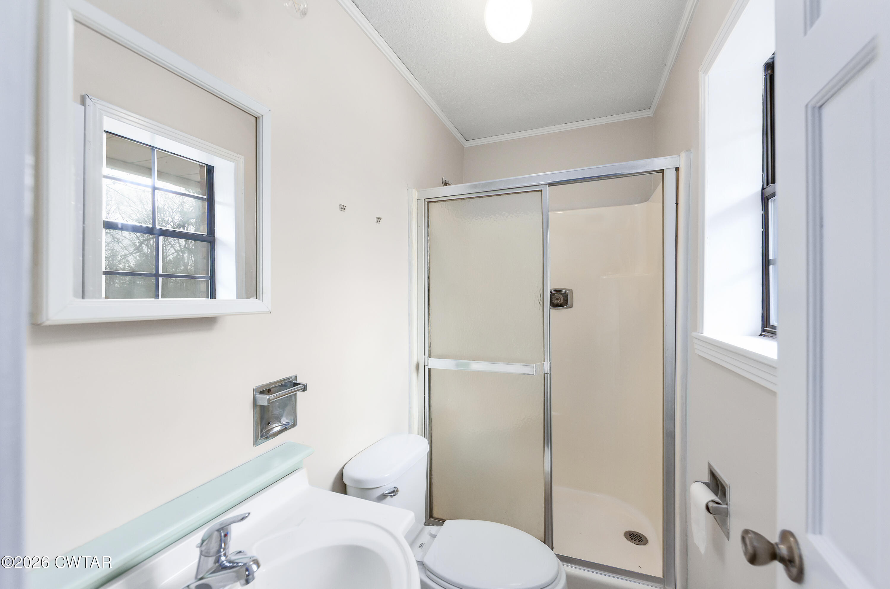 192 New Salem Road Bethel Springs, TN 38315 - Photo 21 of 32 a bathroom with a toilet and a shower