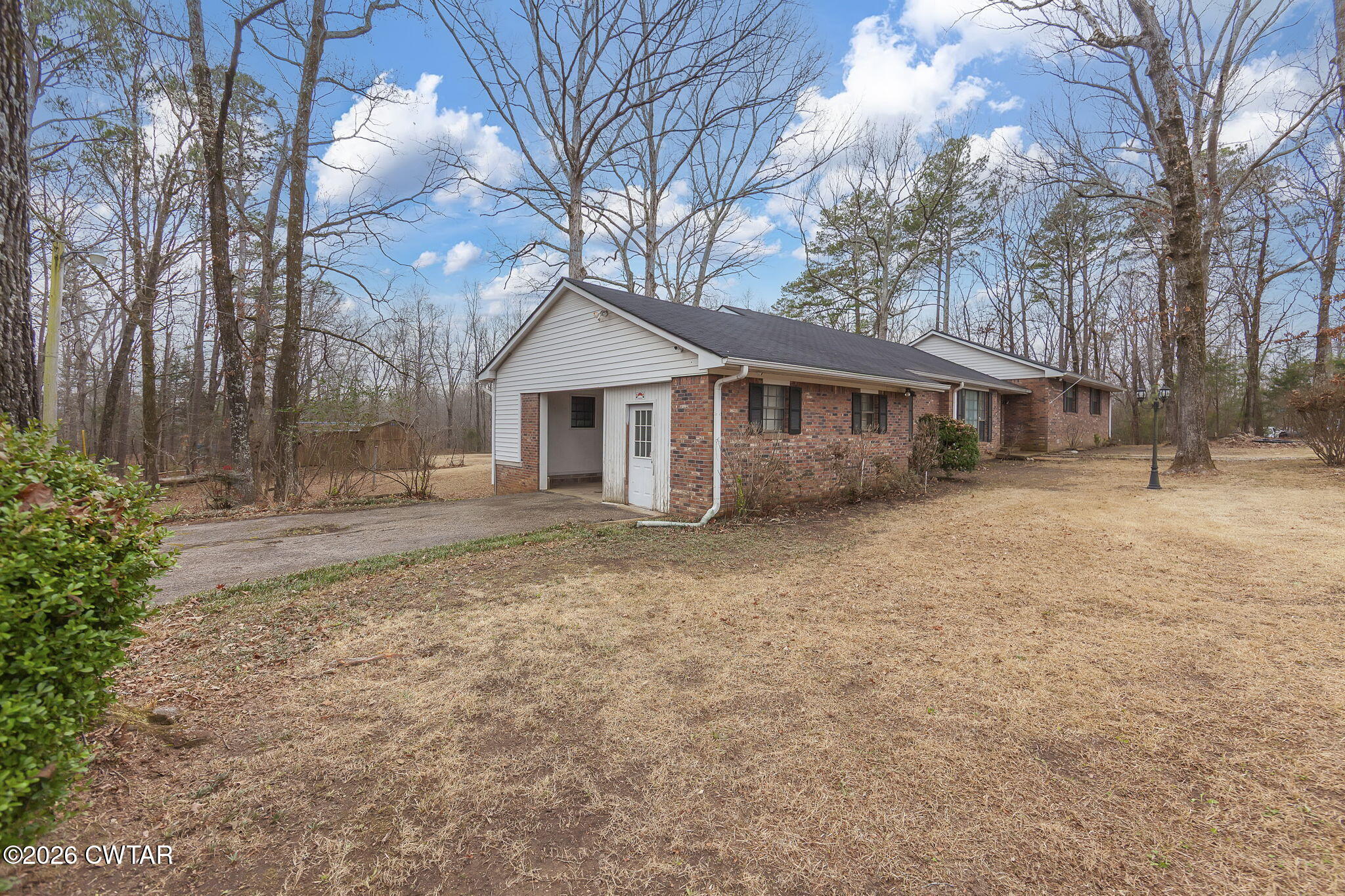 192 New Salem Road Bethel Springs, TN 38315 - Photo 27 of 32 a view of a house with a yard covered in snow