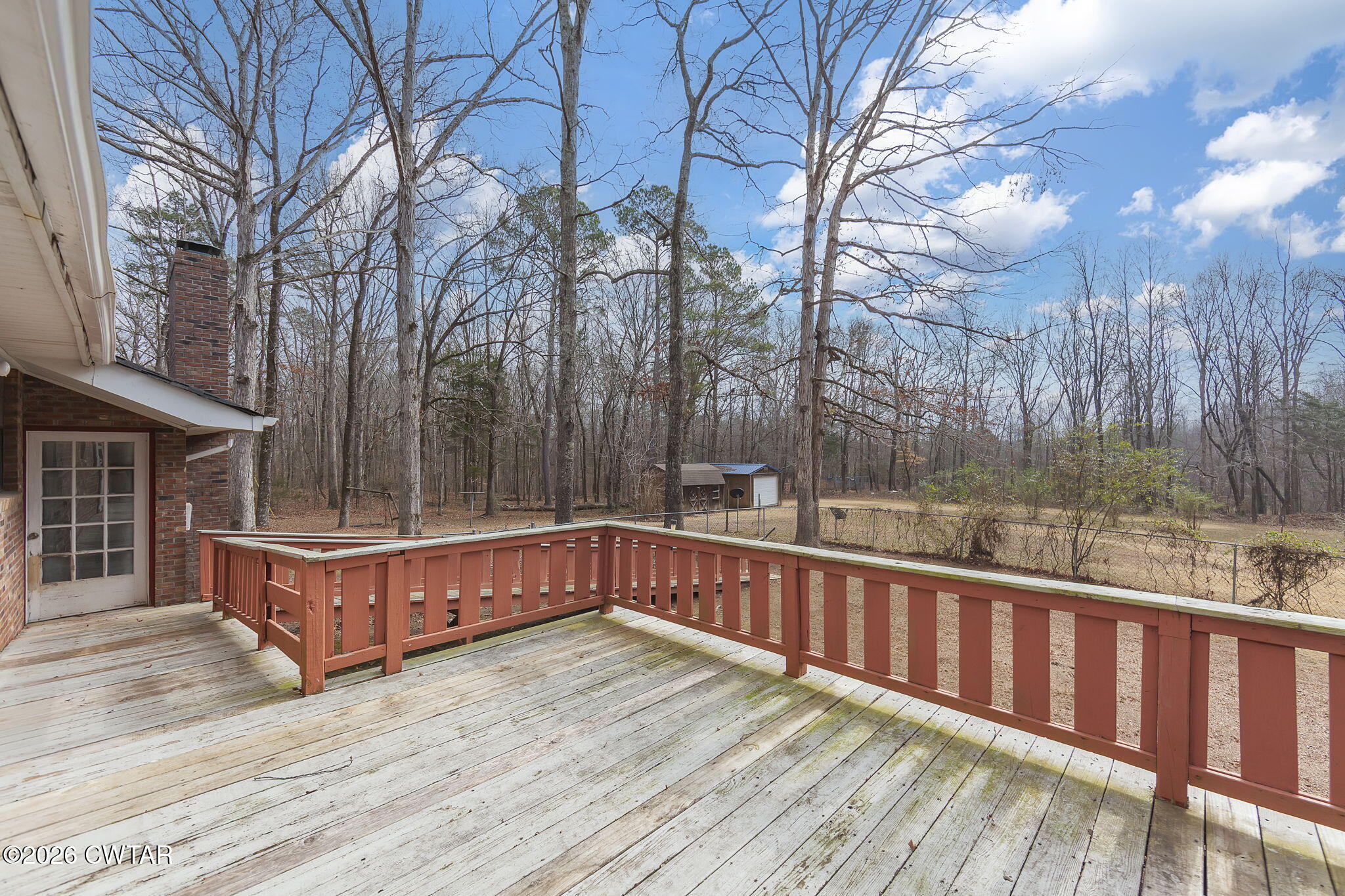 192 New Salem Road Bethel Springs, TN 38315 - Photo 29 of 32 a view of a wooden deck with a yard