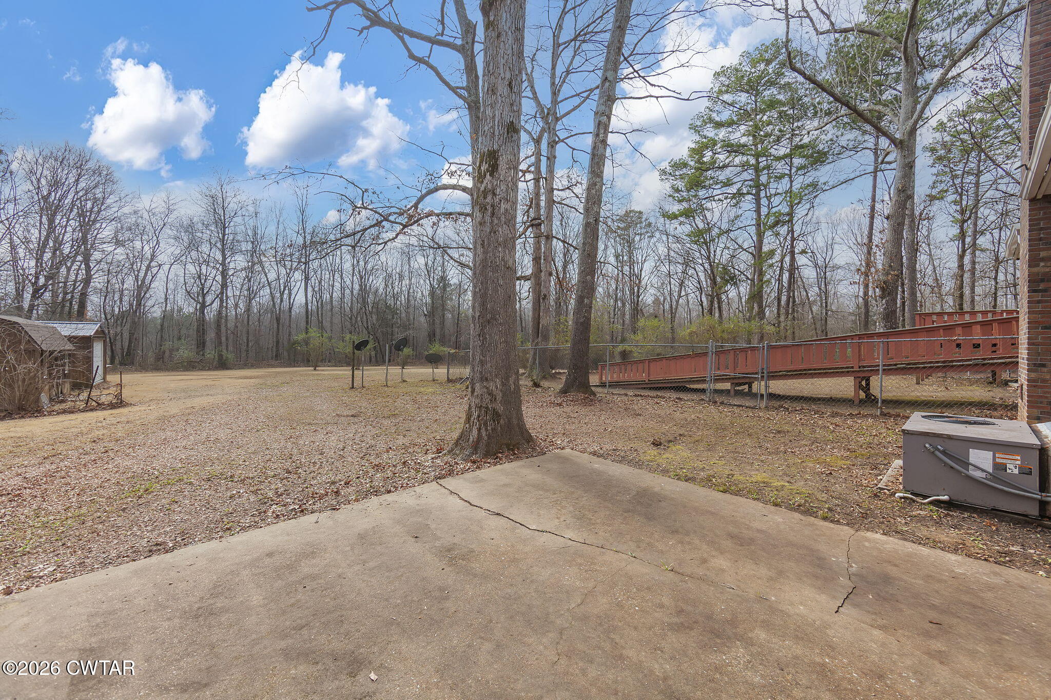 192 New Salem Road Bethel Springs, TN 38315 - Photo 30 of 32 a backyard of a house with lots of green space
