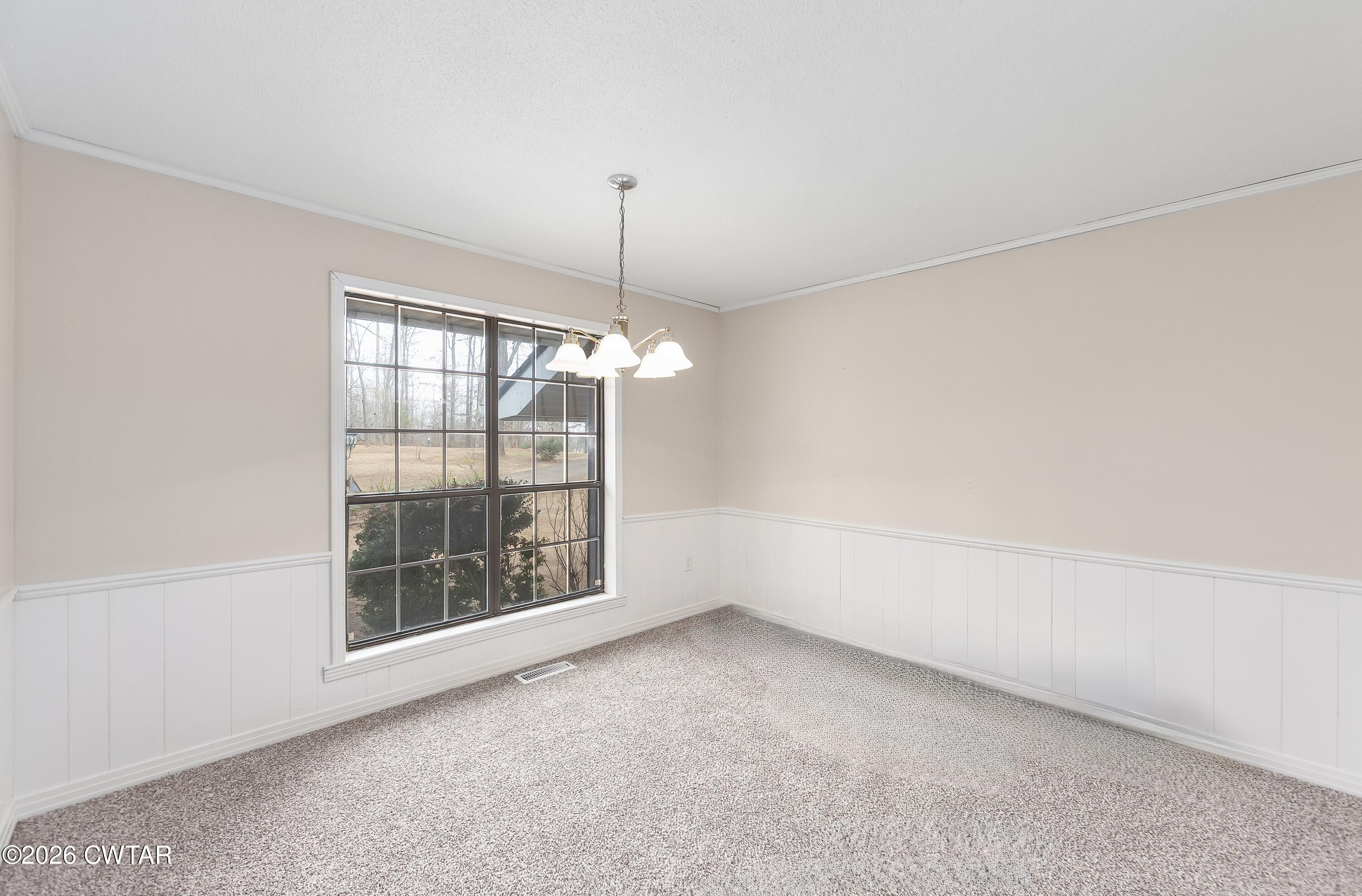 192 New Salem Road Bethel Springs, TN 38315 - Photo 5 of 32 a view of an empty room with a window