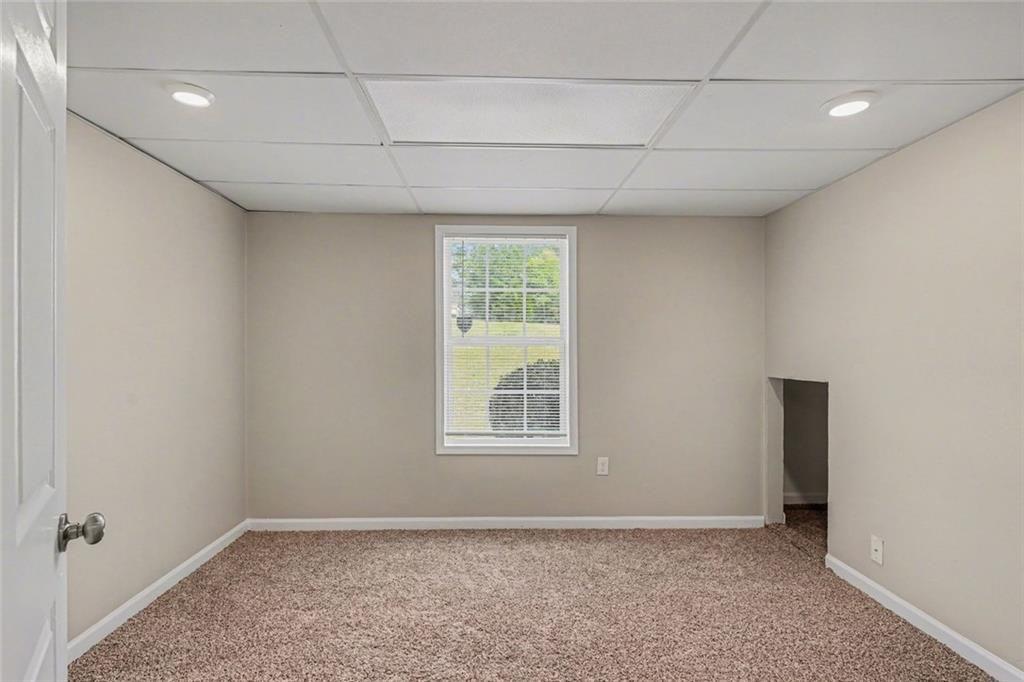 10 Wilbur Way Covington, GA 30016 - Photo 18 of 22 a view of an empty room with a window