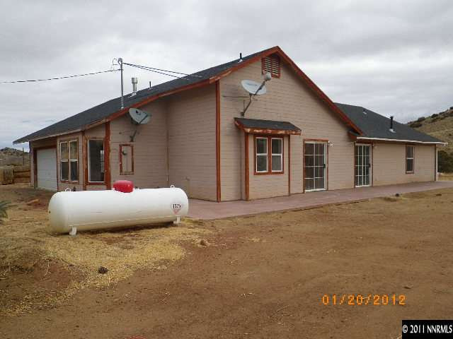 3230 Outback Lane Reno, NV 89510 - Photo 1 of 13 a view of a house with backyard and garage