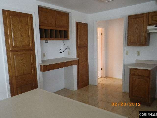 3230 Outback Lane Reno, NV 89510 - Photo 2 of 13 a bathroom with a sink and a mirror