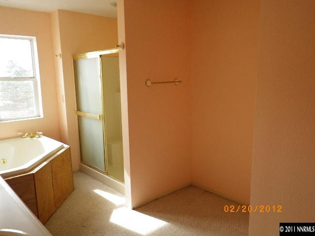 3230 Outback Lane Reno, NV 89510 - Photo 7 of 13 a bathroom with a tub and sink