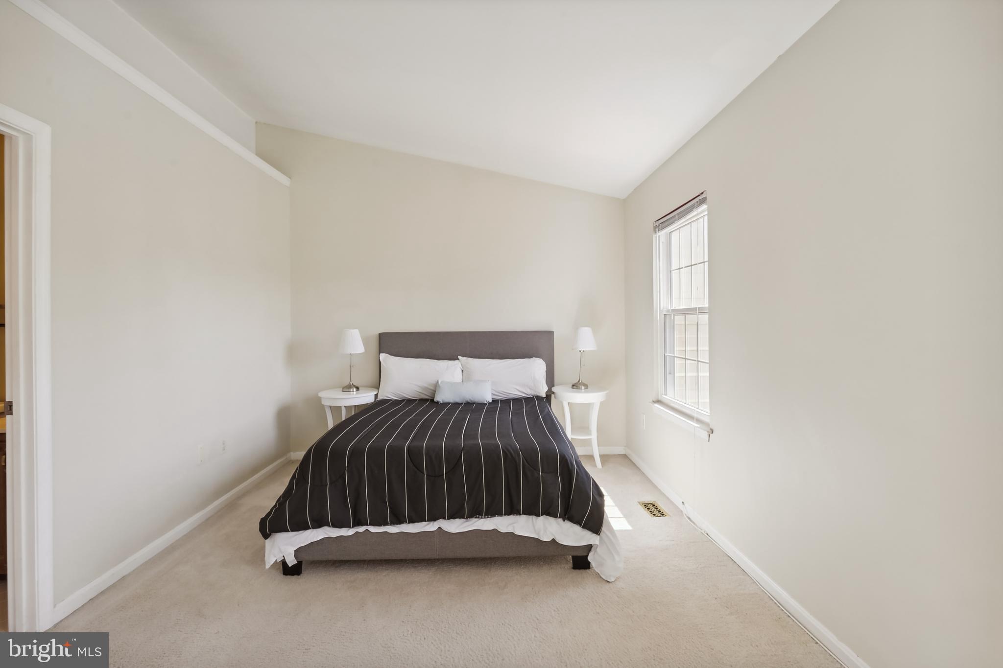12319 Sandy Point Court Silver Spring, MD 20904 - Photo 18 of 41 a bedroom with a bed and a window