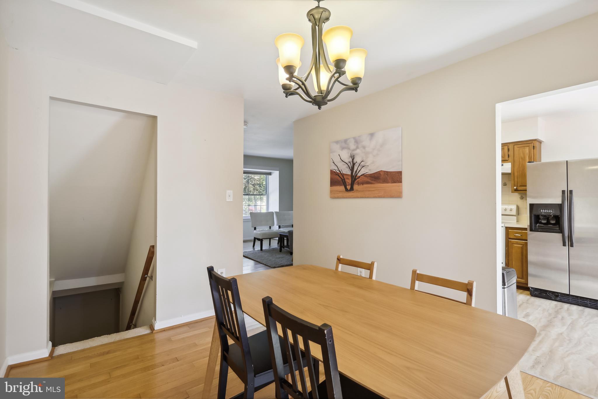 12319 Sandy Point Court Silver Spring, MD 20904 - Photo 8 of 41 a view of a dining room with furniture and wooden floor