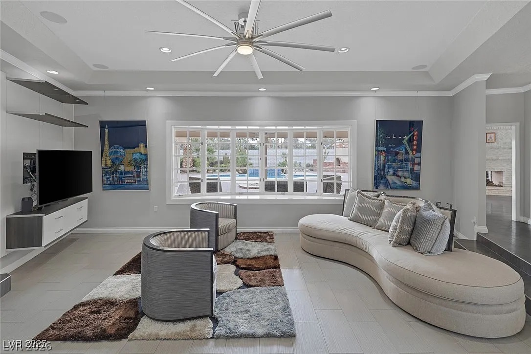 9 Quail Run Road Henderson, NV 89014 - Photo 8 of 57 Bright bay window views overlooking a sparkling outdoor pool create an inviting living space.