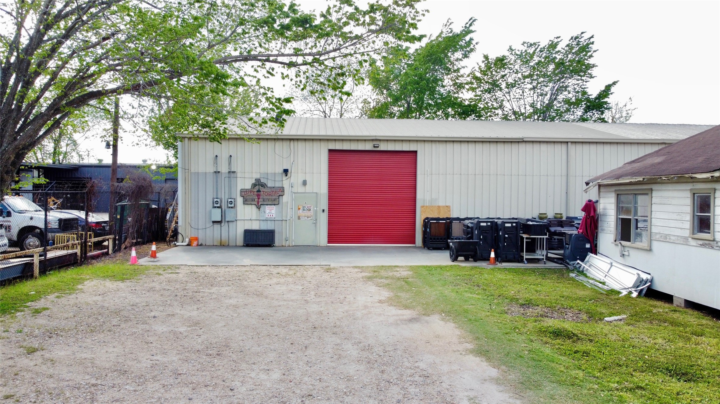 6951 Windfern Road Houston, TX 77040 - Photo 5 of 8 a view of a house with a yard and garage