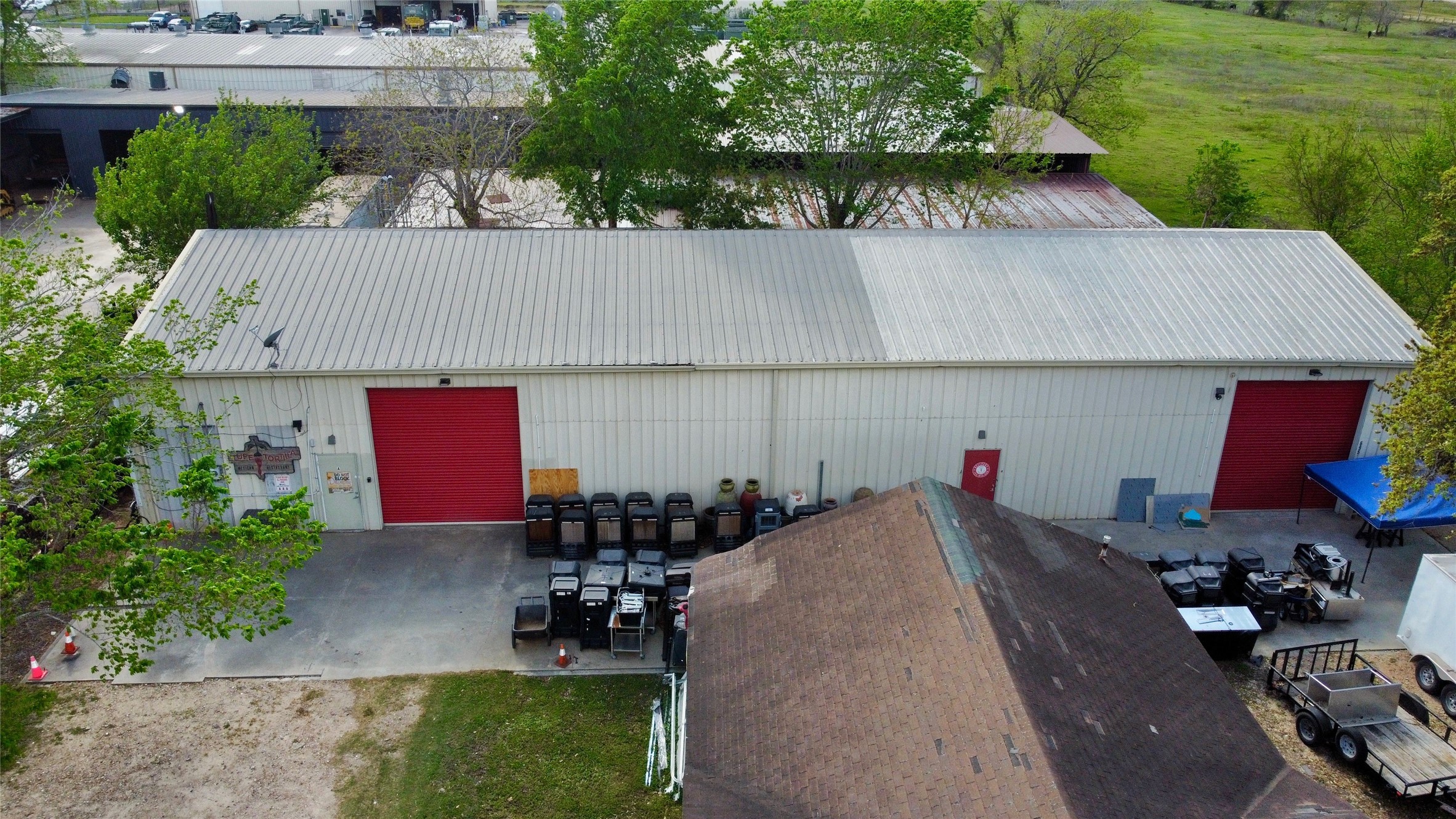 6951 Windfern Road Houston, TX 77040 - Photo 6 of 8 a aerial view of a house with yard