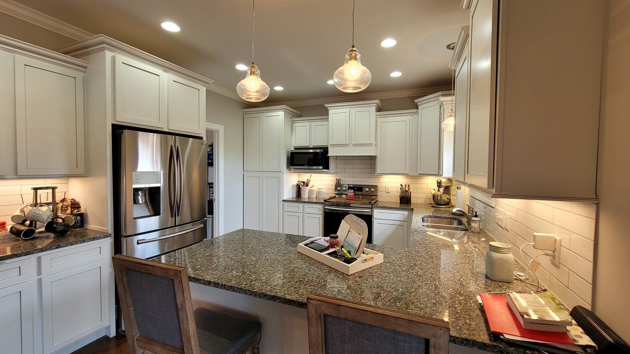 2710 Union Road White House, TN 37188 - Photo 8 of 25 a kitchen with kitchen island granite countertop a sink counter top space appliances and cabinets