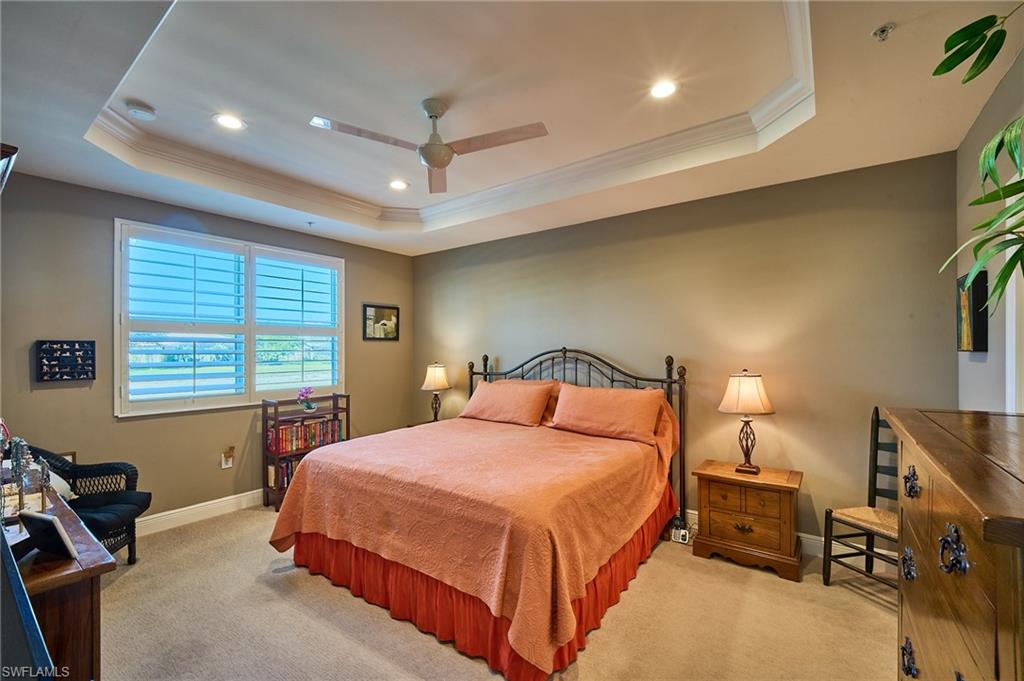 2319 Sawyers Hill Road, Unit 701 Naples, FL 34120 - Photo 12 of 36 a bedroom with a bed and a desk