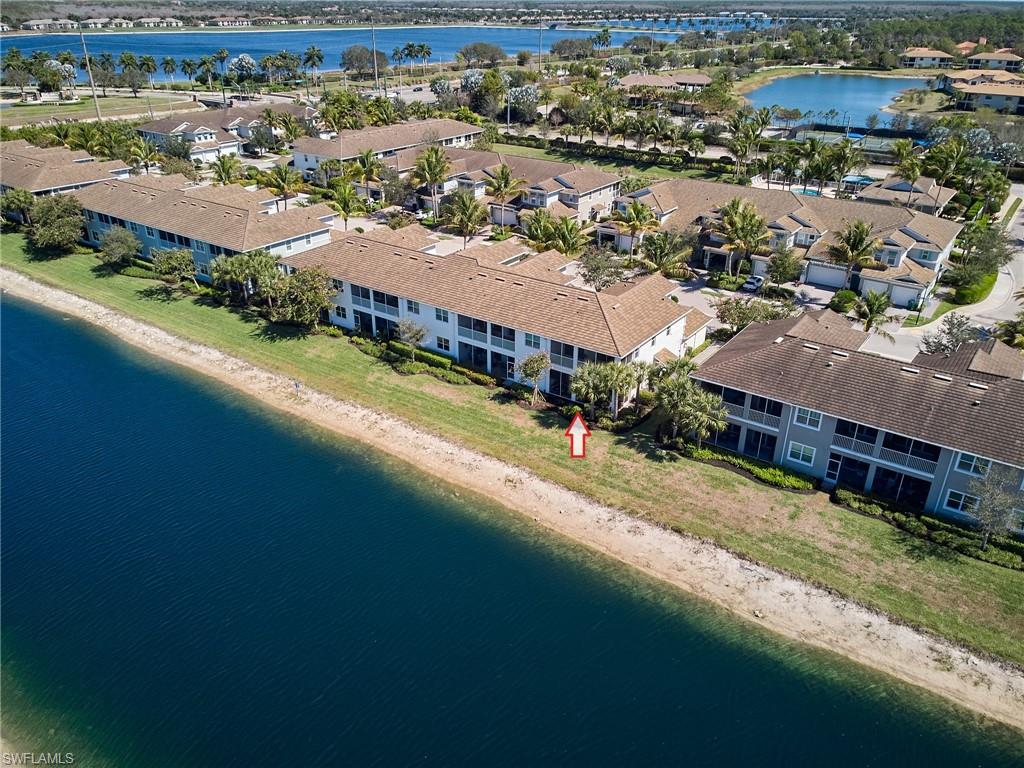 2319 Sawyers Hill Road, Unit 701 Naples, FL 34120 - Photo 23 of 36 an aerial view of residential houses with outdoor space and river