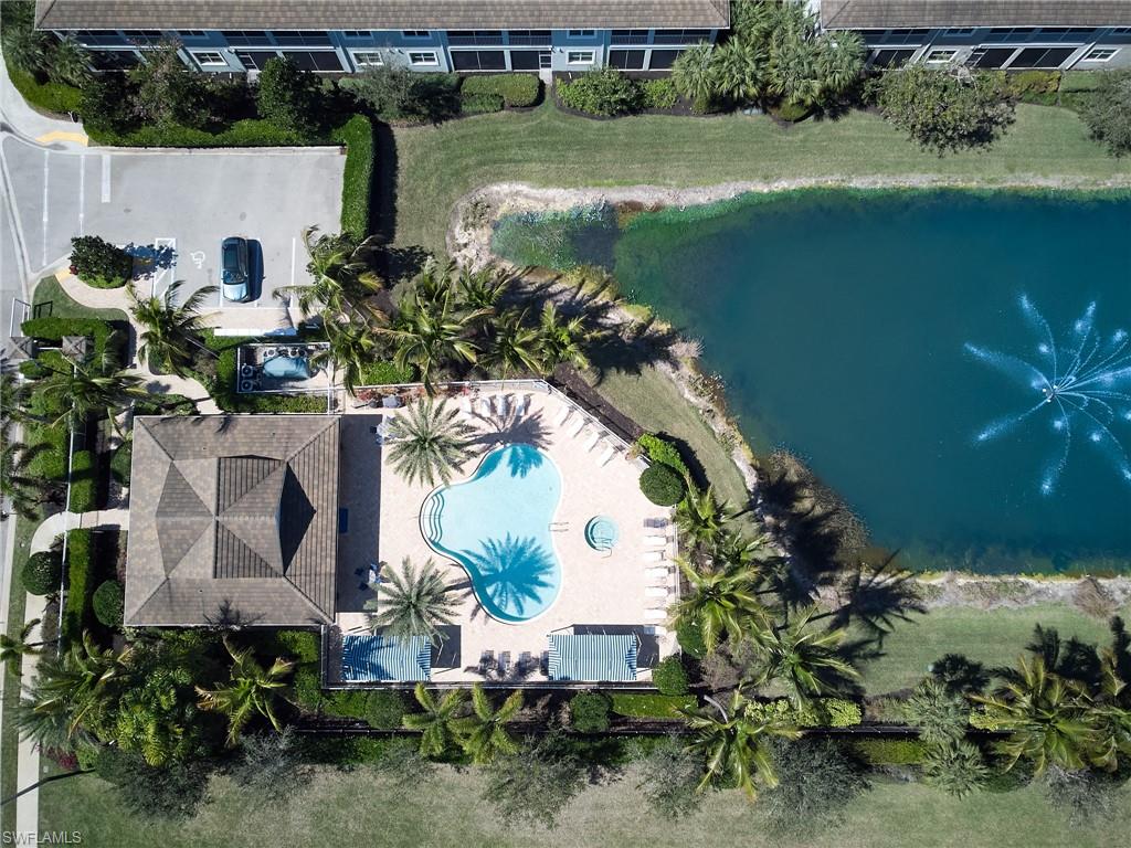 2319 Sawyers Hill Road, Unit 701 Naples, FL 34120 - Photo 28 of 36 an aerial view of a house with a yard and lake view