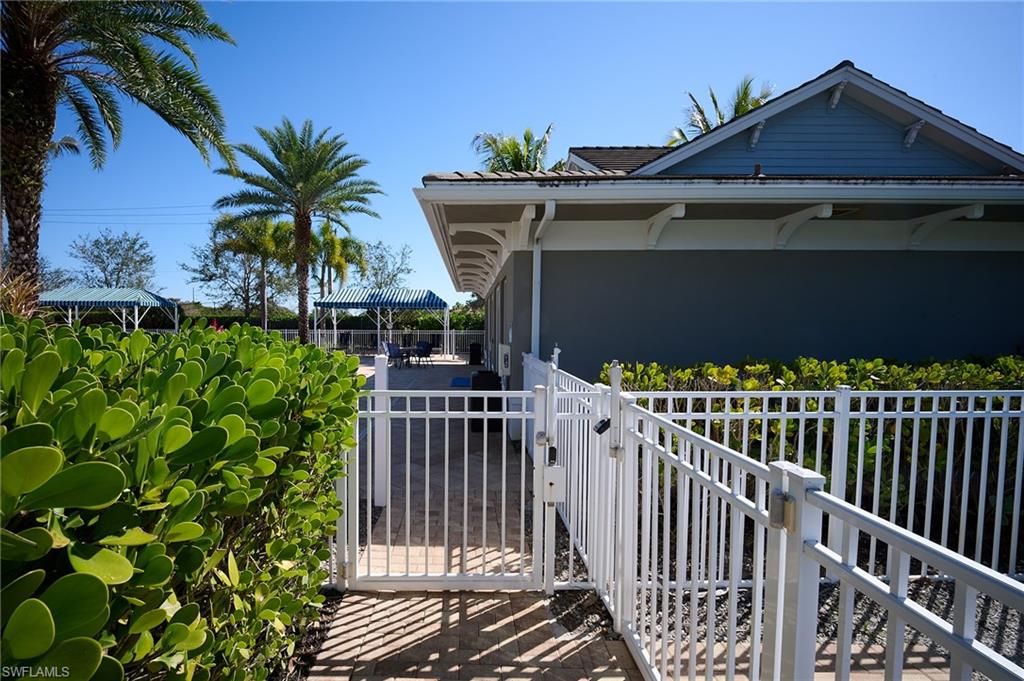 2319 Sawyers Hill Road, Unit 701 Naples, FL 34120 - Photo 29 of 36 a view of a house with a flower garden
