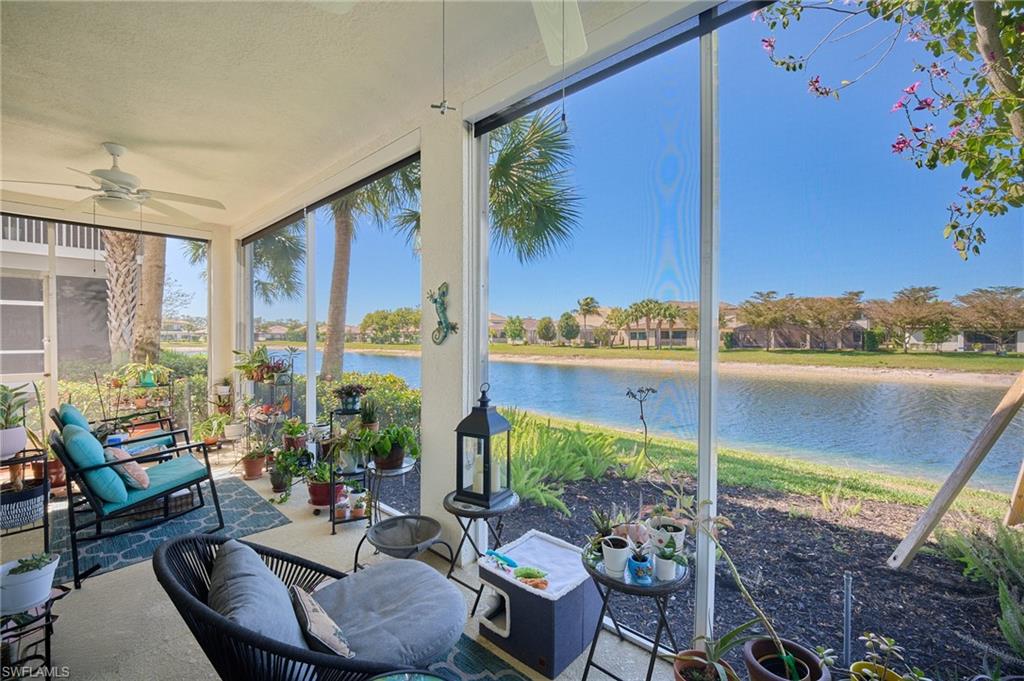 2319 Sawyers Hill Road, Unit 701 Naples, FL 34120 - Photo 3 of 36 a living room with patio area