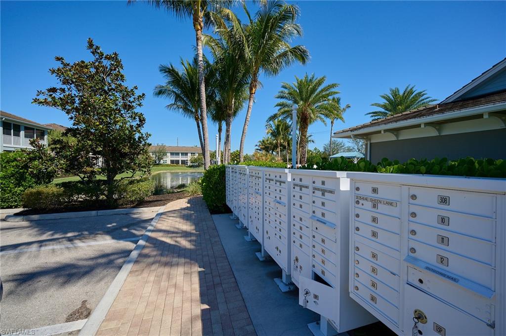 2319 Sawyers Hill Road, Unit 701 Naples, FL 34120 - Photo 31 of 36 a view of a street with a large trees