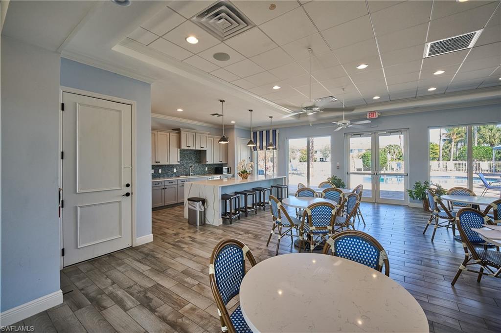 2319 Sawyers Hill Road, Unit 701 Naples, FL 34120 - Photo 32 of 36 a very nice looking living room with a large window