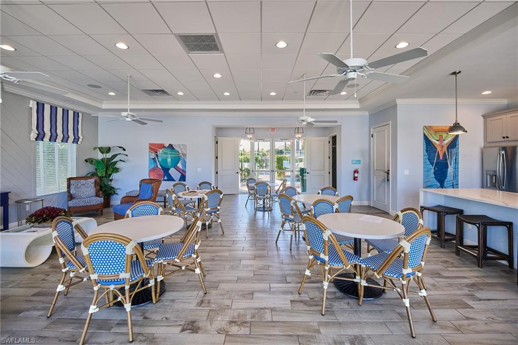 2319 Sawyers Hill Road, Unit 701 Naples, FL 34120 - Photo 35 of 36 a view of a dining room with furniture