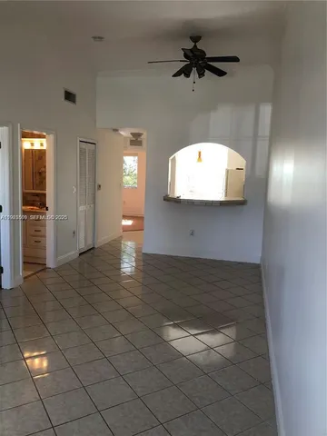 a view of a hallway with a chandelier
