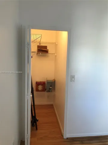 a view of a bathroom from a hallway