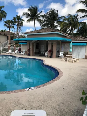 a view of a swimming pool with a patio