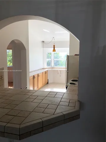 a view of a living room with a large window