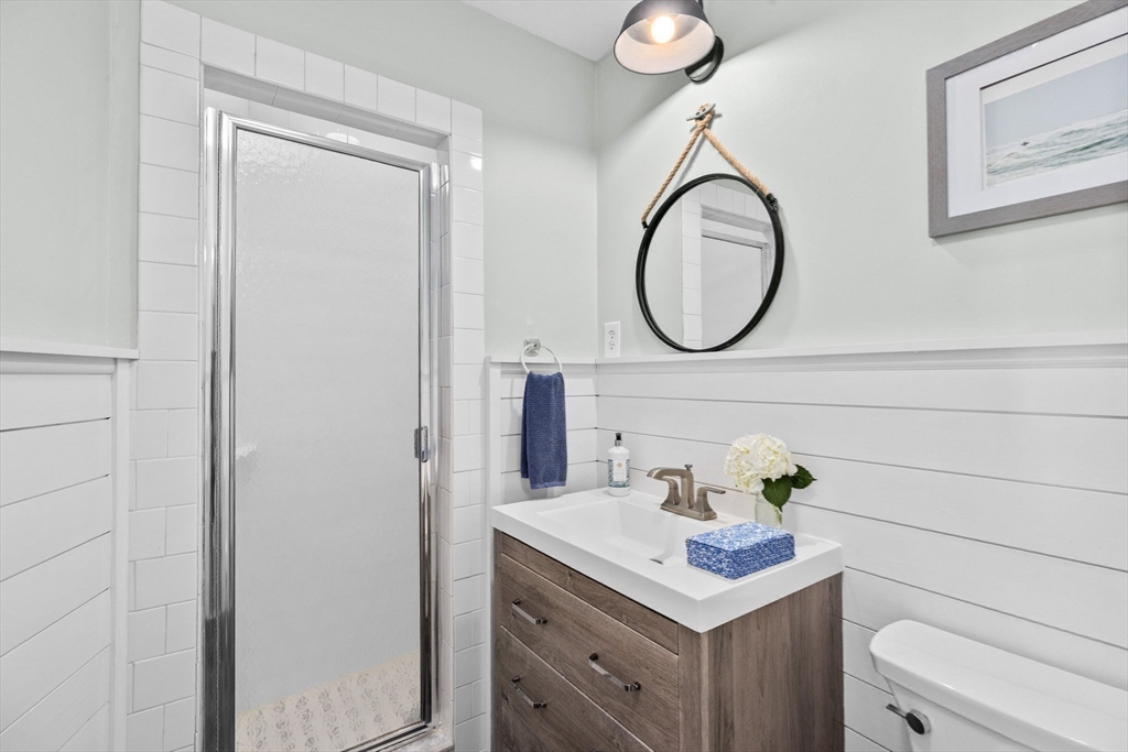 18 Hatherly Road Scituate, MA 02066 - Photo 11 of 42 a bathroom with a sink and a mirror