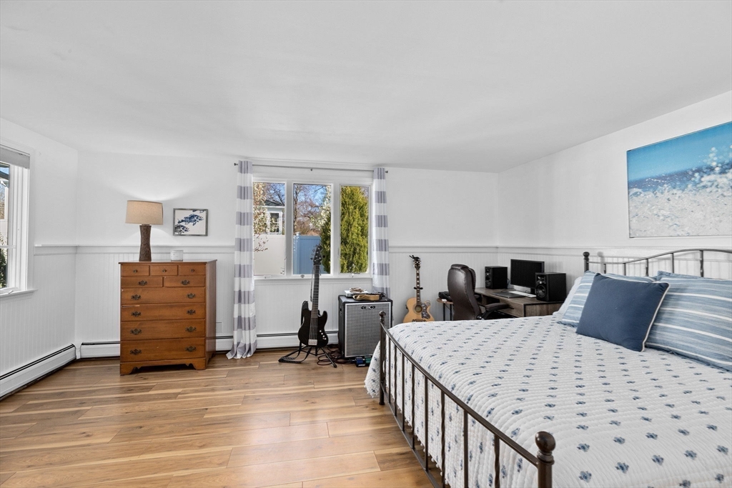 18 Hatherly Road Scituate, MA 02066 - Photo 12 of 42 a bedroom with a bed and wooden floor