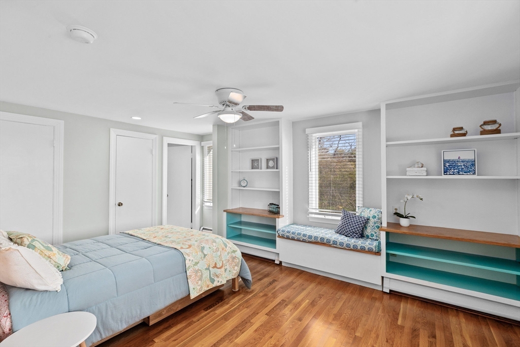 18 Hatherly Road Scituate, MA 02066 - Photo 13 of 42 a spacious bedroom with a bed and wooden floor