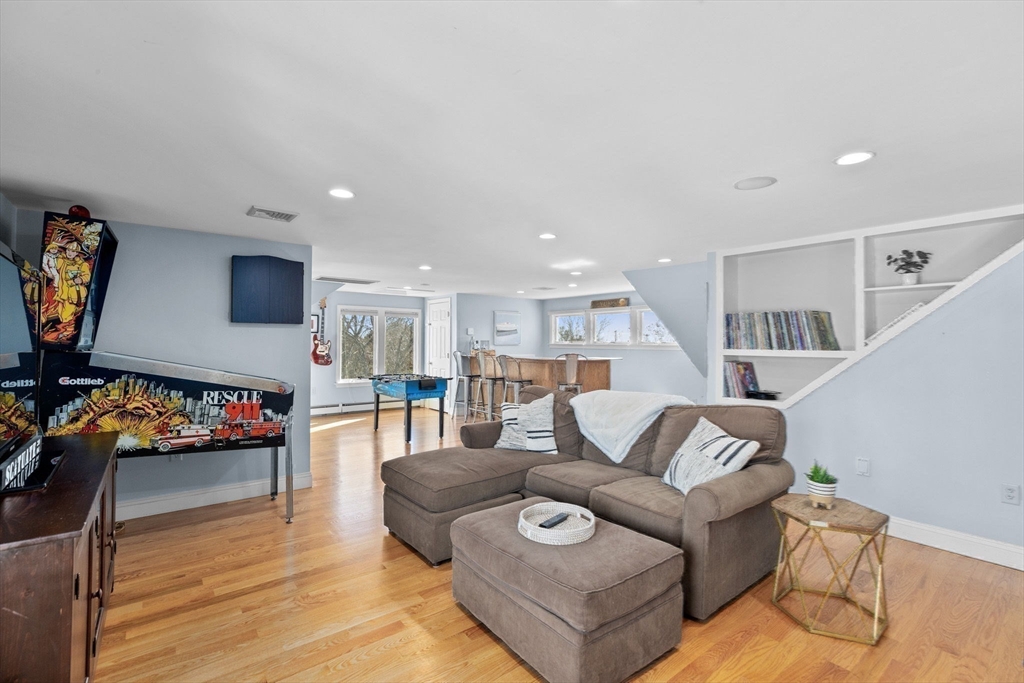 18 Hatherly Road Scituate, MA 02066 - Photo 28 of 42 a living room with furniture and a flat screen tv