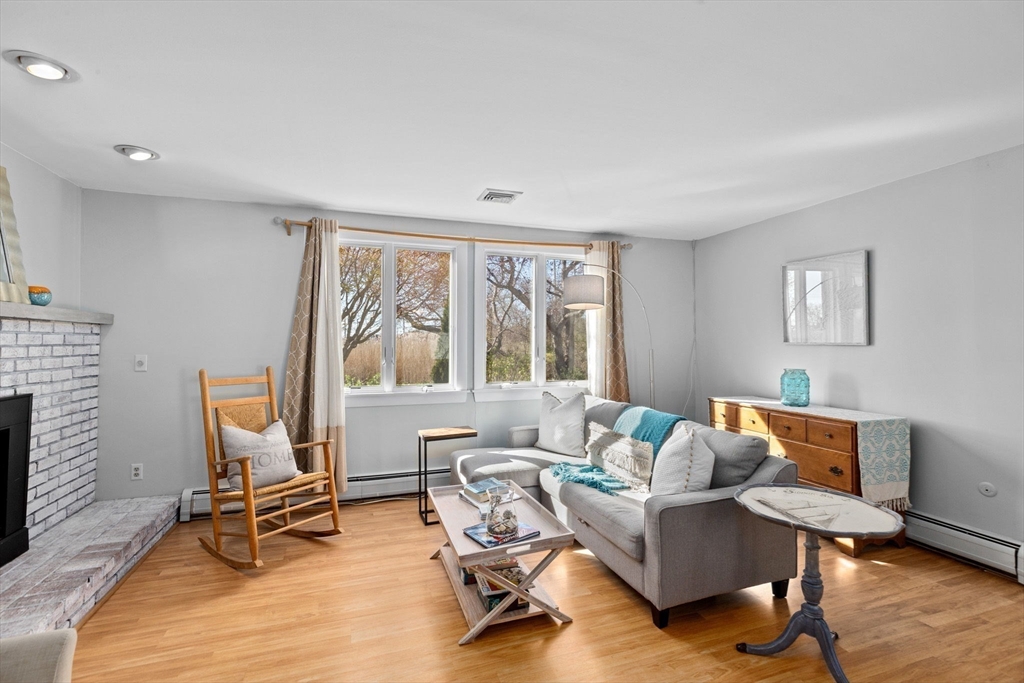 18 Hatherly Road Scituate, MA 02066 - Photo 38 of 42 a living room with furniture and a floor to ceiling window