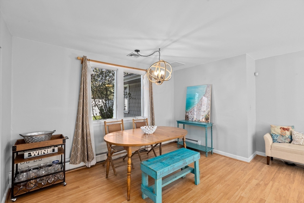 18 Hatherly Road Scituate, MA 02066 - Photo 39 of 42 a living room with furniture and a wooden floor
