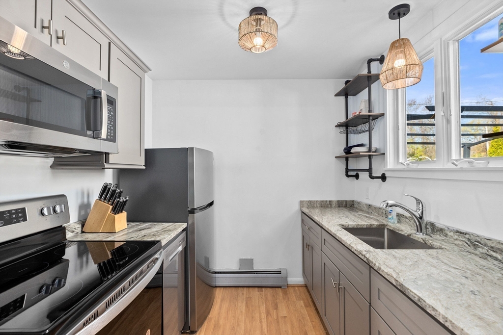 18 Hatherly Road Scituate, MA 02066 - Photo 40 of 42 a kitchen with a stove and a sink
