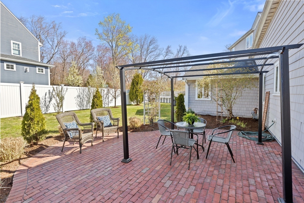 18 Hatherly Road Scituate, MA 02066 - Photo 42 of 42 a view of a chairs and table in patio with a barbeque