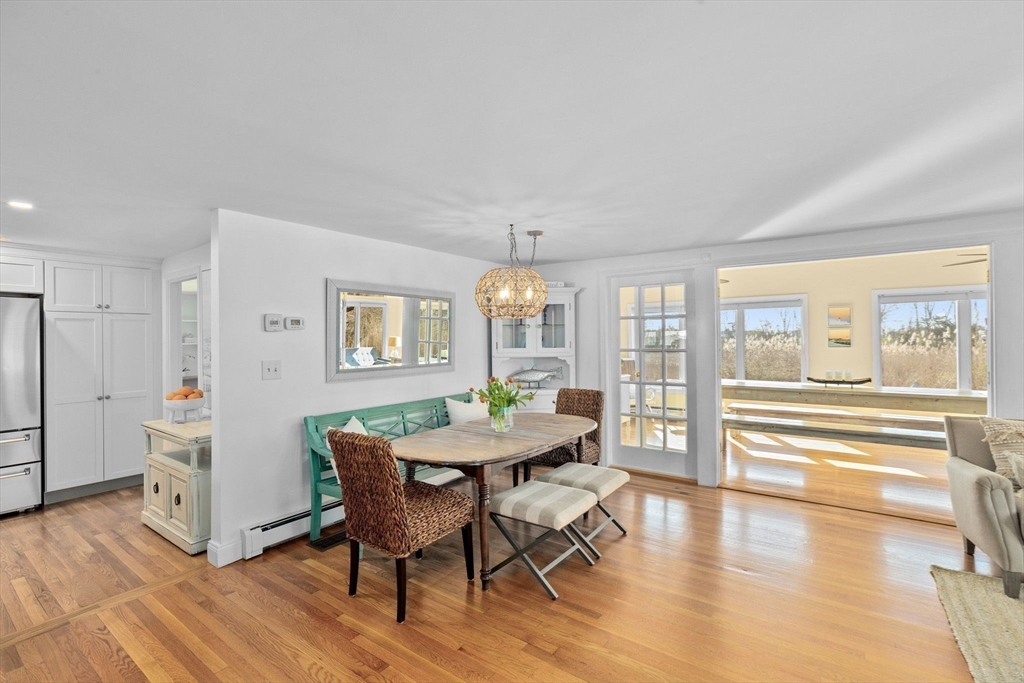 18 Hatherly Road Scituate, MA 02066 - Photo 6 of 42 a view of a dining room with furniture wooden floor and chandelier