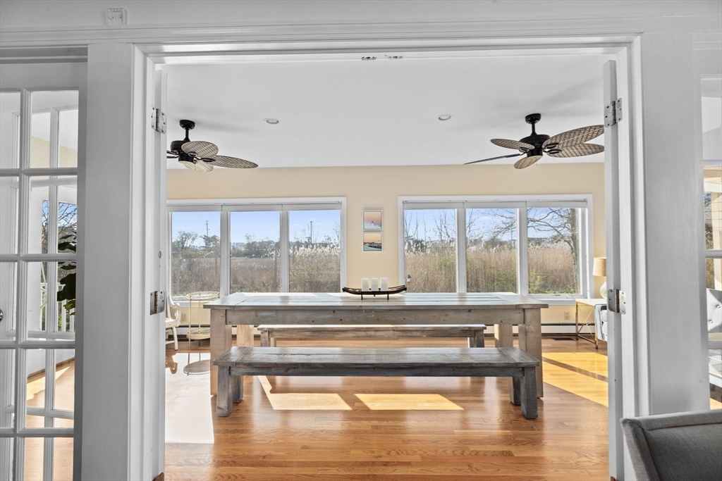 18 Hatherly Road Scituate, MA 02066 - Photo 7 of 42 a living room with hardwood floor and a ceiling fan