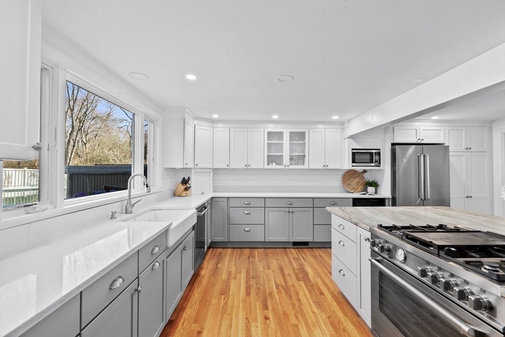 18 Hatherly Road Scituate, MA 02066 - Photo 8 of 42 a large kitchen with a stove sink and cabinets