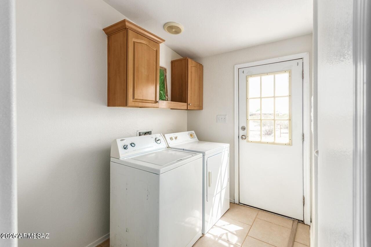 12085 North Musket Road Marana, AZ 85653 - Photo 12 of 13 a utility room with dryer and washer
