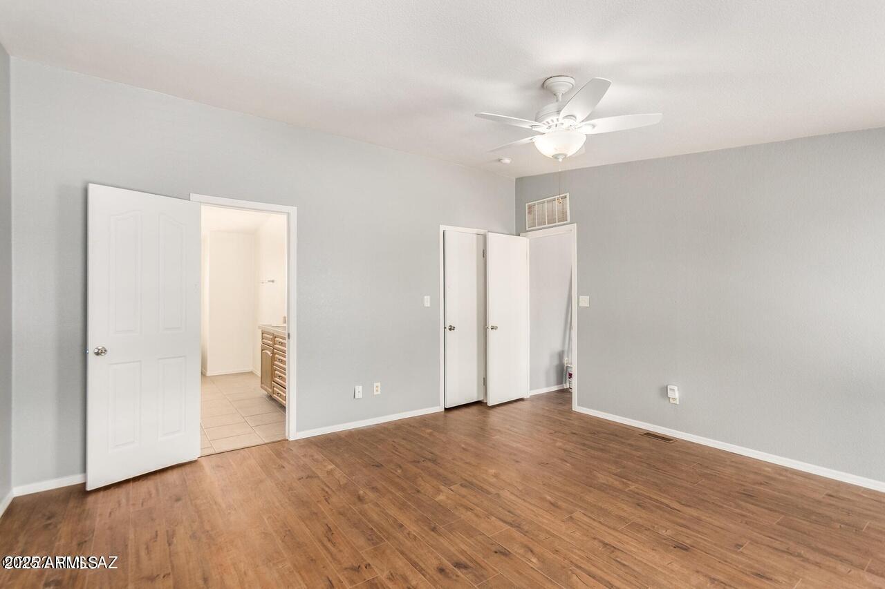 12085 North Musket Road Marana, AZ 85653 - Photo 9 of 13 a view of an empty room with wooden floor
