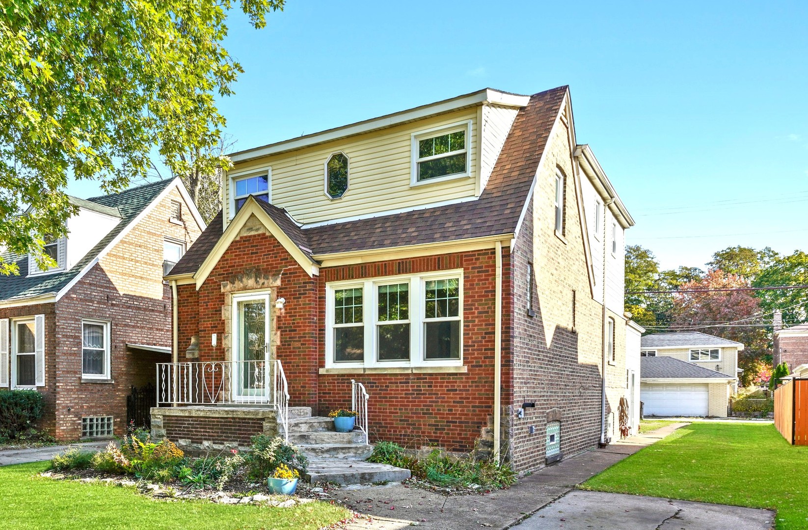 13115 South Escanaba Avenue Chicago, IL 60633 - Photo 1 of 24 a front view of a house with a yard