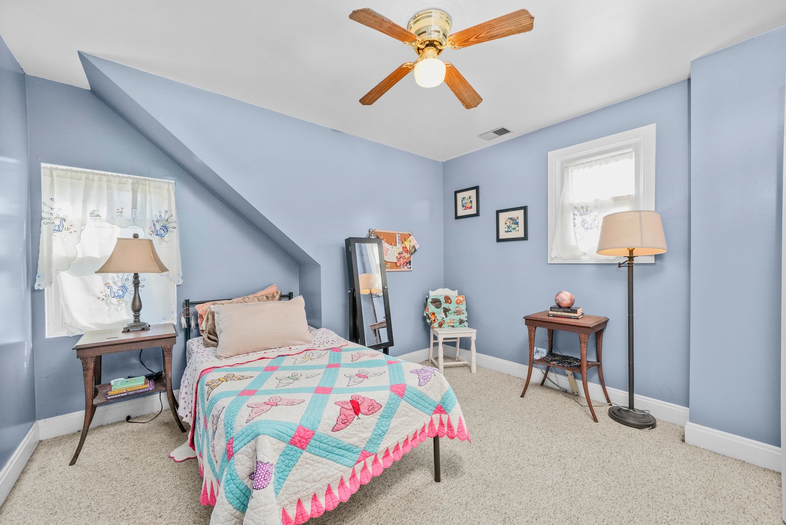 13115 South Escanaba Avenue Chicago, IL 60633 - Photo 14 of 24 a bedroom with a bed and a chandelier