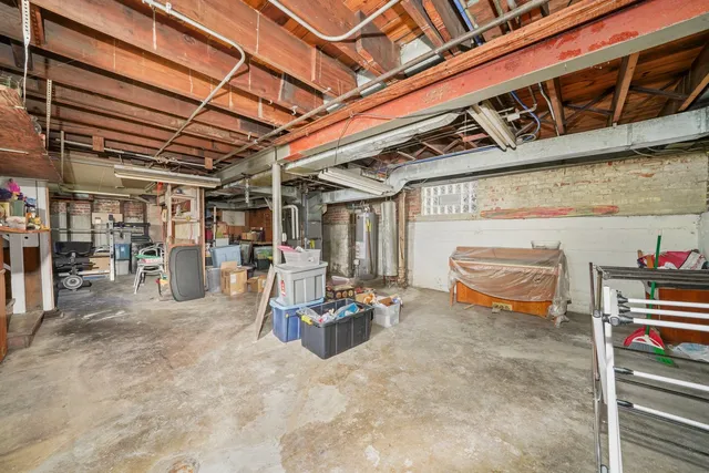 a view of parking garage with cars