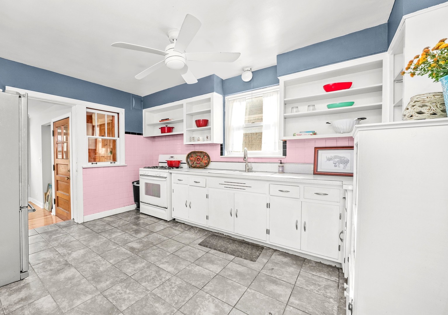 13115 South Escanaba Avenue Chicago, IL 60633 - Photo 7 of 24 a utility room with cabinets a washer and a large mirror