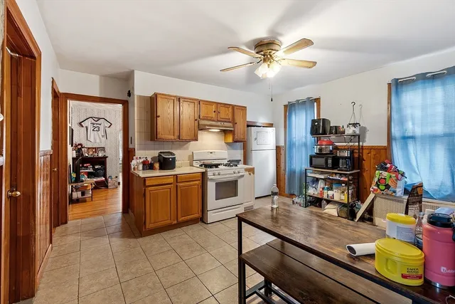 a kitchen with stainless steel appliances granite countertop a stove and cabinets