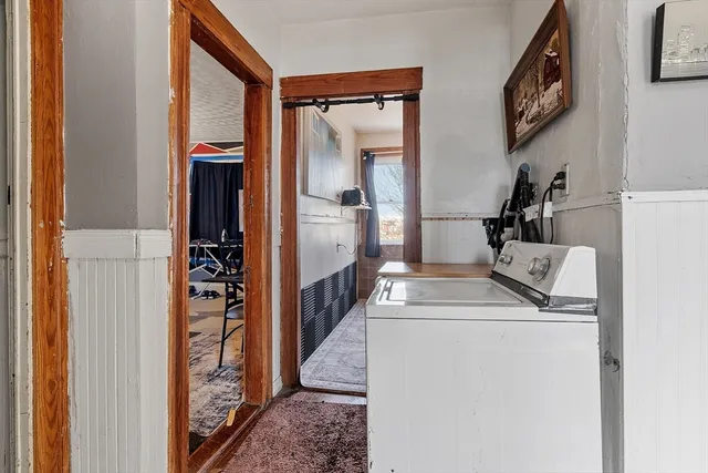 a kitchen view with a sink and a refrigerator