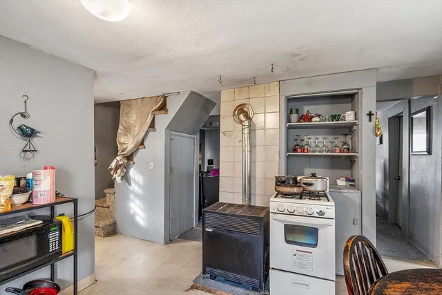 a kitchen with stainless steel appliances a refrigerator and a stove