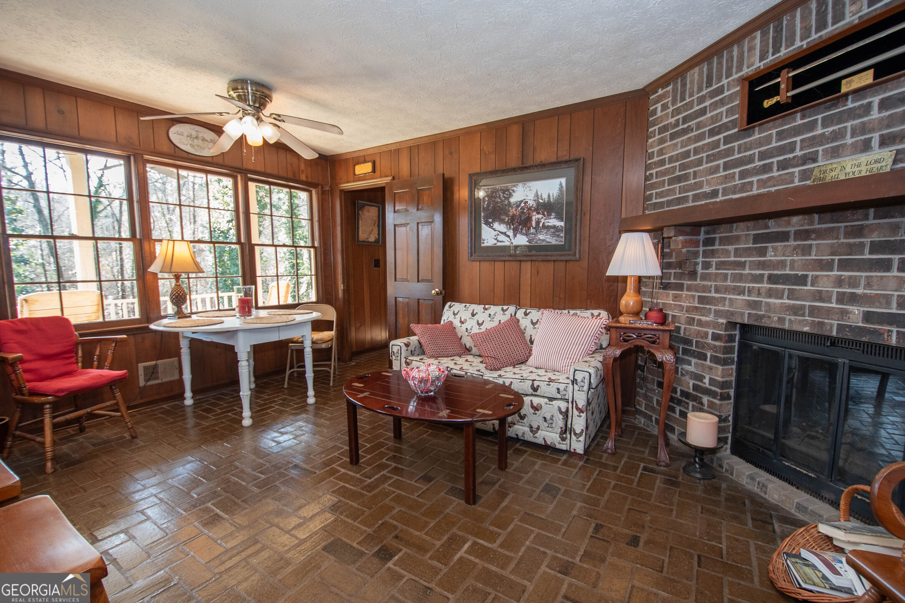 151 Evans Road Milner, GA 30257 - Photo 8 of 53 a living room with furniture a large window and a fireplace