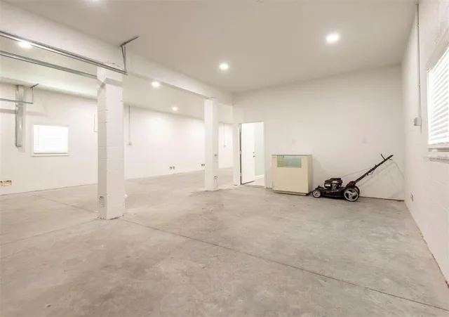 a view of a room with gym equipment and a large window